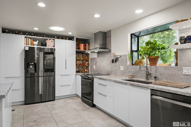 3255 Corey Dr, Reno, NV 89509 - kitchen with open shelves, stainless steel appliances, wall chimney exhaust hood, a sink, and recessed lighting