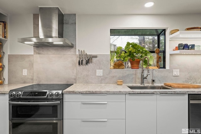 3255 Corey Dr, Reno, NV 89509 - kitchen featuring wall chimney range hood, range with two ovens, a sink, decorative backsplash, and recessed lighting