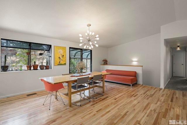 3255 Corey Dr, Reno, NV 89509 - dining room with light wood-style flooring, a chandelier, and healthy amount of natural light