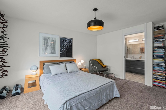 3255 Corey Dr, Reno, NV 89509 - bedroom featuring carpet floors, a sink, connected bathroom, and baseboards