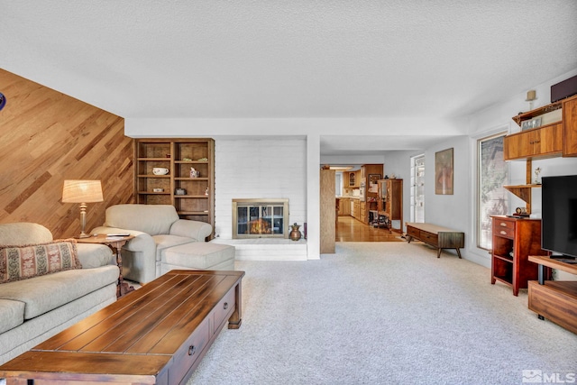 2012 Branch Ln, Reno, NV 89509 - carpeted living room with wood walls, a textured ceiling, a fireplace, and built in features