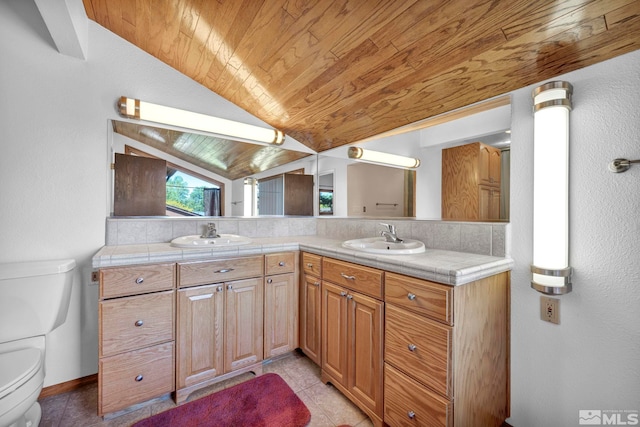 2012 Branch Ln, Reno, NV 89509 - full bathroom with wooden ceiling, lofted ceiling, double vanity, tile patterned floors, and decorative backsplash
