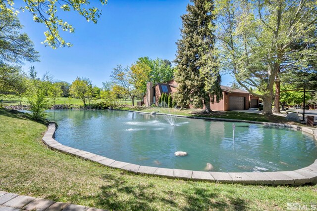2012 Branch Ln, Reno, NV 89509 - outdoor pool featuring a lawn