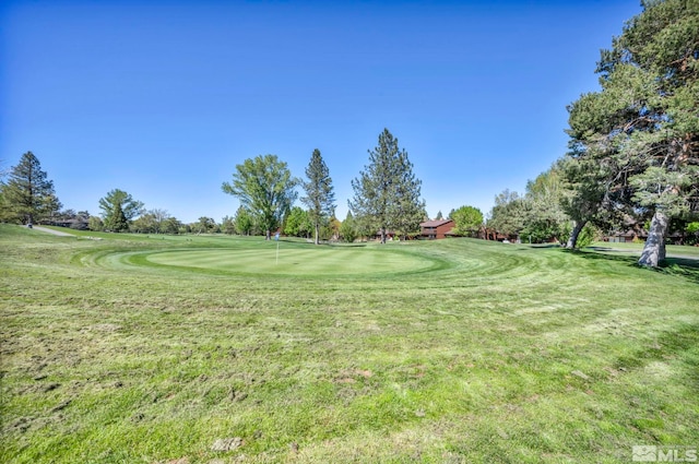 2012 Branch Ln, Reno, NV 89509 - surrounding community with a lawn, view of golf course, and an area to practice putting