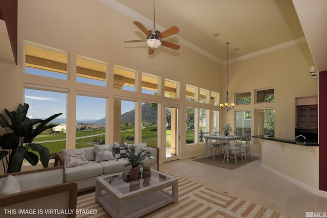 2459 Genoa Highlands, Genoa, NV 89411 - sunroom featuring a towering ceiling, a mountain view, carpet floors, a chandelier, and ornamental molding