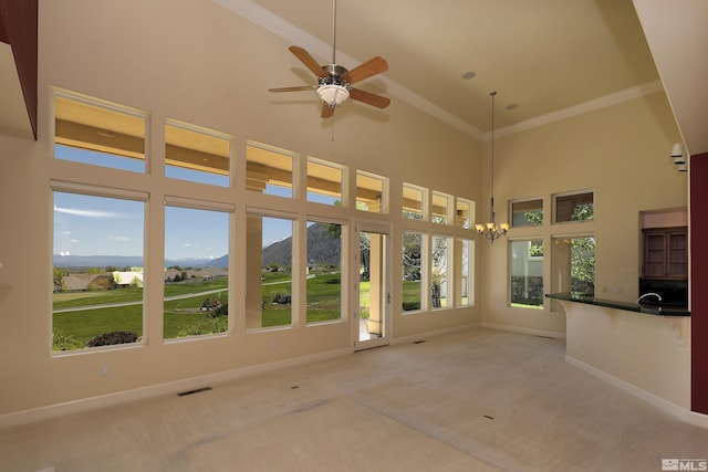 2459 Genoa Highlands, Genoa, NV 89411 - unfurnished sunroom with a mountain view, a chandelier, and vaulted ceiling
