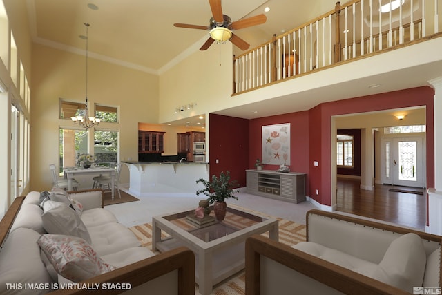 2459 Genoa Highlands, Genoa, NV 89411 - living room with a chandelier, light carpet, a high ceiling, baseboards, and a ceiling fan