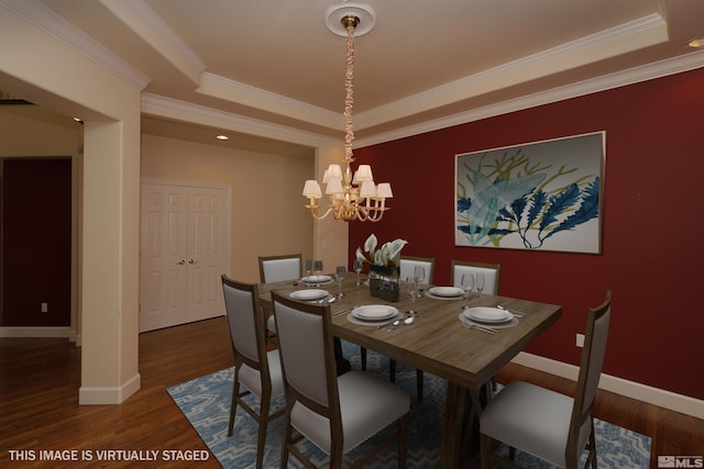 2459 Genoa Highlands, Genoa, NV 89411 - dining space featuring a raised ceiling, baseboards, wood finished floors, a chandelier, and ornamental molding
