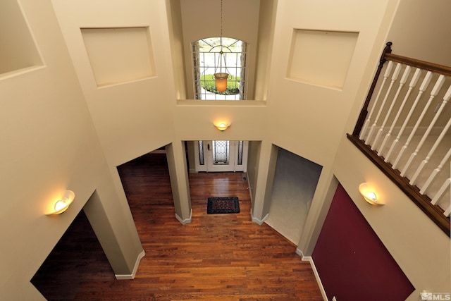 2459 Genoa Highlands, Genoa, NV 89411 - stairway featuring a high ceiling, wood finished floors, and a chandelier
