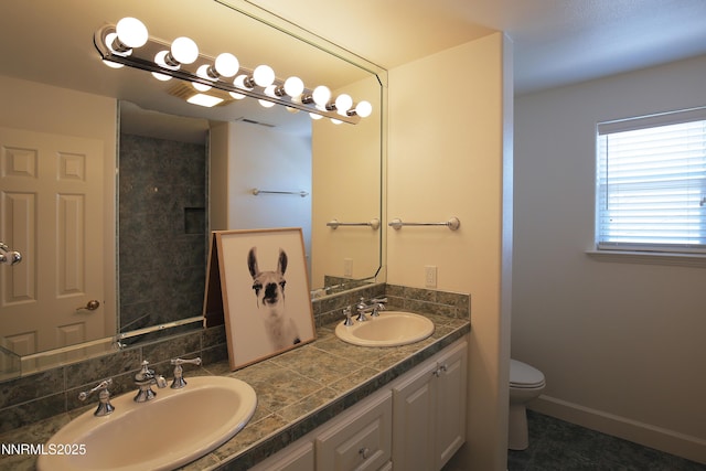 2459 Genoa Highlands, Genoa, NV 89411 - bathroom featuring toilet, double vanity, tile patterned floors, and baseboards