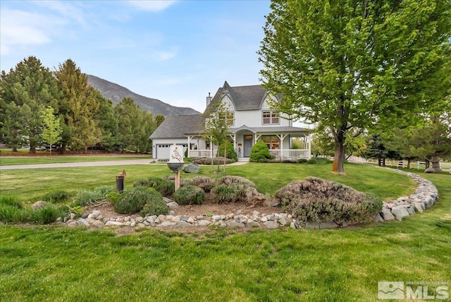 212 Foothill Meadows Ct, Genoa, NV 89411 - victorian house with covered porch, an attached garage, a front yard, driveway, and a mountain view
