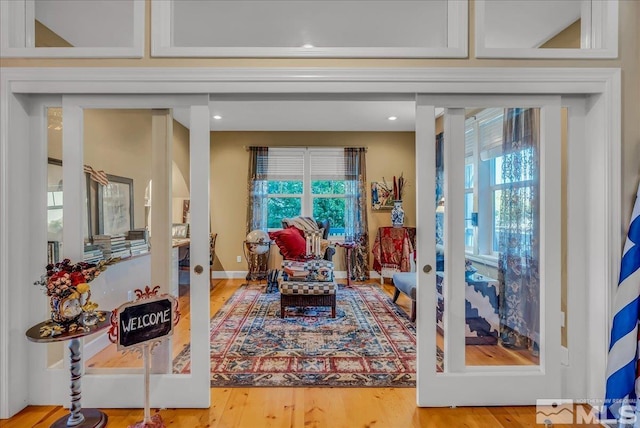 212 Foothill Meadows Ct, Genoa, NV 89411 - living area with healthy amount of natural light, french doors, and wood finished floors