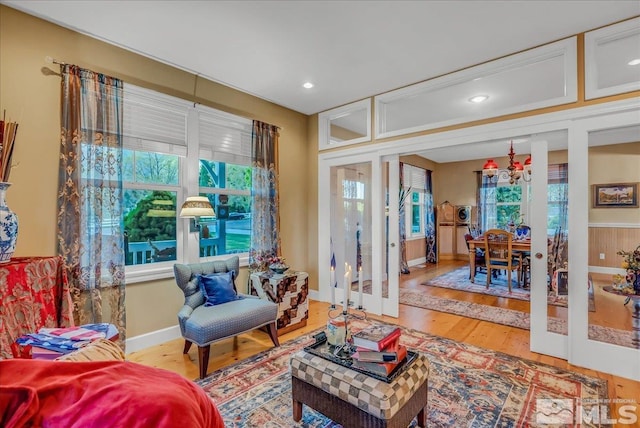 212 Foothill Meadows Ct, Genoa, NV 89411 - living room featuring wood finished floors, healthy amount of natural light, baseboards, french doors, and recessed lighting