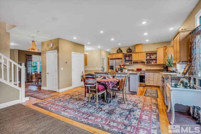 212 Foothill Meadows Ct, Genoa, NV 89411 - dining room featuring light wood-style floors, stairs, recessed lighting, and baseboards