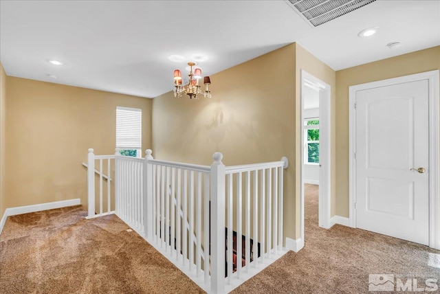 212 Foothill Meadows Ct, Genoa, NV 89411 - corridor with carpet, an upstairs landing, a chandelier, baseboards, and recessed lighting
