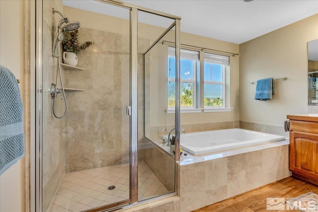 212 Foothill Meadows Ct, Genoa, NV 89411 - bathroom featuring vanity, a bath, wood finished floors, and a stall shower