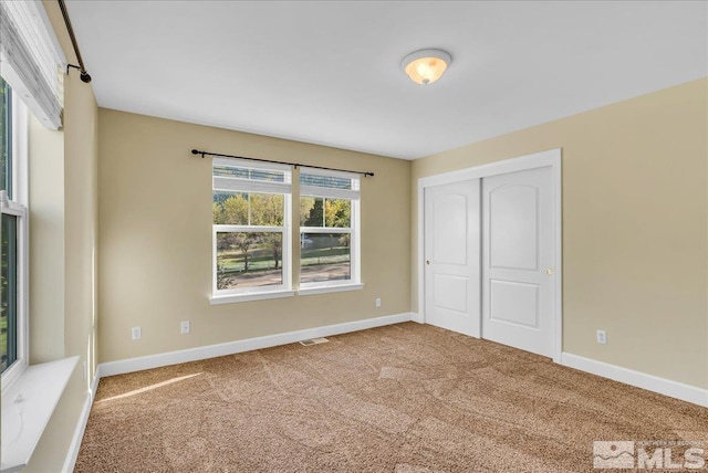 212 Foothill Meadows Ct, Genoa, NV 89411 - unfurnished bedroom featuring carpet, a closet, and baseboards