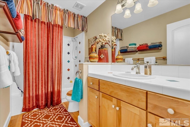 212 Foothill Meadows Ct, Genoa, NV 89411 - full bathroom featuring shower / tub combo, vanity, toilet, wood finished floors, and a chandelier