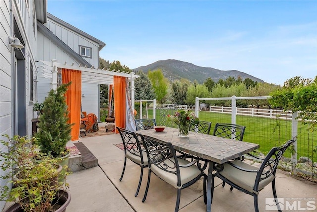 212 Foothill Meadows Ct, Genoa, NV 89411 - view of patio with outdoor dining area, a mountain view, and a pergola