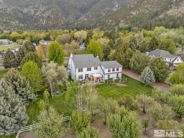 212 Foothill Meadows Ct, Genoa, NV 89411 - aerial view of property and surrounding area with a heavily wooded area and a mountain backdrop