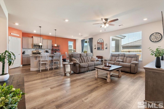 101 Cloud Berry Ct, Sparks, NV 89441 - living room with light wood finished floors, healthy amount of natural light, ceiling fan, and recessed lighting