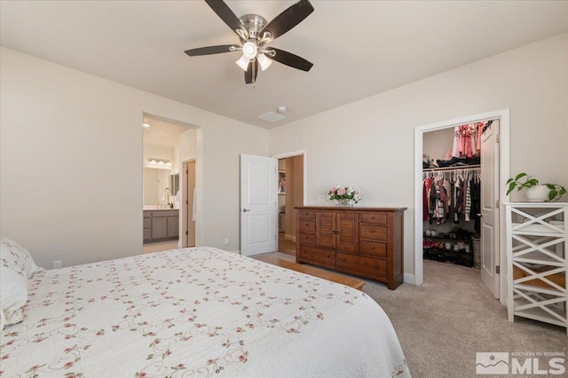 101 Cloud Berry Ct, Sparks, NV 89441 - bedroom with a spacious closet, a closet, light carpet, ensuite bath, and a ceiling fan