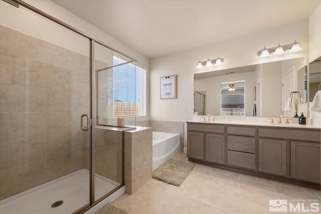 101 Cloud Berry Ct, Sparks, NV 89441 - bathroom with a shower stall, tile patterned floors, a garden tub, and double vanity