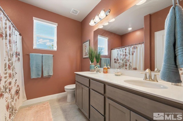 101 Cloud Berry Ct, Sparks, NV 89441 - full bathroom featuring toilet, double vanity, baseboards, tile patterned flooring, and a shower with curtain