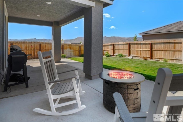 101 Cloud Berry Ct, Sparks, NV 89441 - view of patio / terrace featuring an outdoor fire pit and a mountain view
