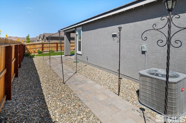 101 Cloud Berry Ct, Sparks, NV 89441 - view of side of property featuring central AC unit, a fenced backyard, and a patio
