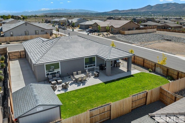 101 Cloud Berry Ct, Sparks, NV 89441 - back of property with a residential view, a patio, and a mountain view