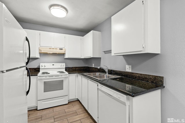 2090 Highview Ct Unit 8, Reno, NV 89512 - kitchen featuring white appliances, under cabinet range hood, a sink, light wood-type flooring, and white cabinetry