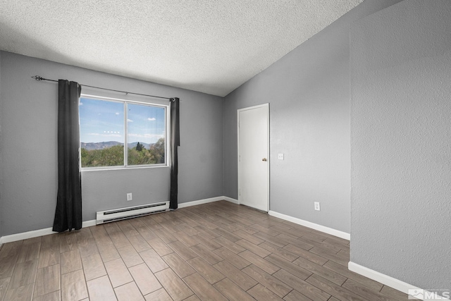 2090 Highview Ct Unit 8, Reno, NV 89512 - spare room featuring baseboard heating, wood finished floors, a textured ceiling, lofted ceiling, and baseboards