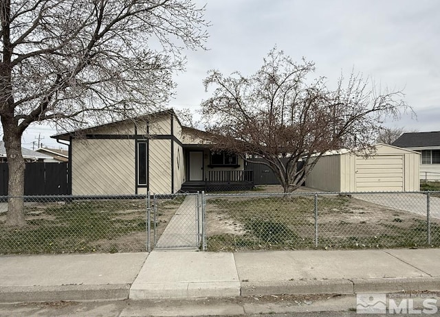 630 Wild Horse Way, Battle Mountain, NV 89820 - view of front of house with a fenced front yard, concrete driveway, and a gate