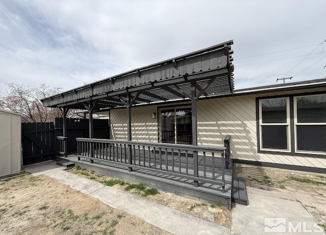 630 Wild Horse Way, Battle Mountain, NV 89820 - rear view of property featuring fence and a porch