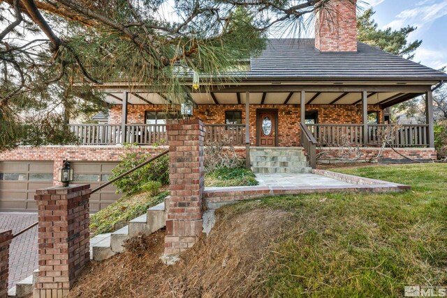 2820 Sagittarius Dr, Reno, NV 89509 - view of front of home featuring a porch, a chimney, and brick siding