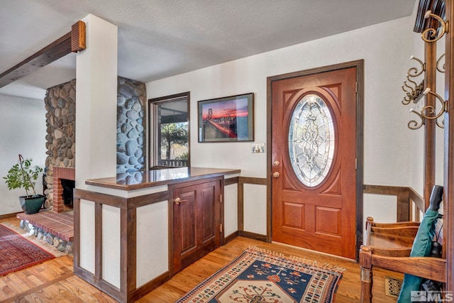 2820 Sagittarius Dr, Reno, NV 89509 - entryway with light wood-type flooring, a textured ceiling, and baseboards