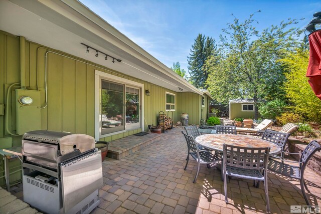 3295 Sunnyvale Ave, Reno, NV 89509 - view of patio / terrace with outdoor dining area, grilling area, an outbuilding, and a shed