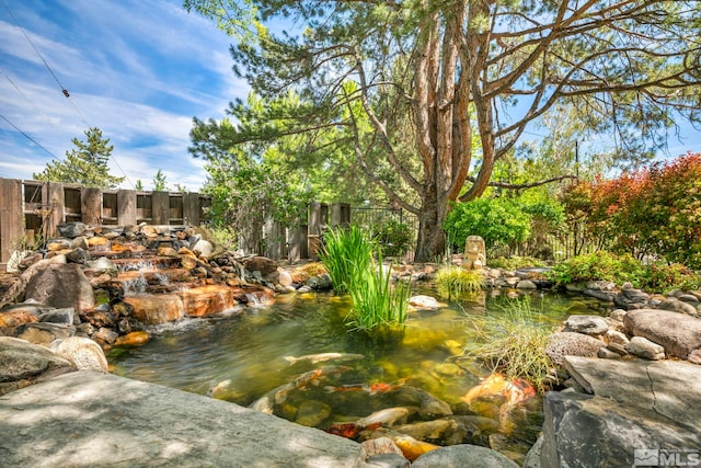 3295 Sunnyvale Ave, Reno, NV 89509 - view of yard featuring a small pond and fence
