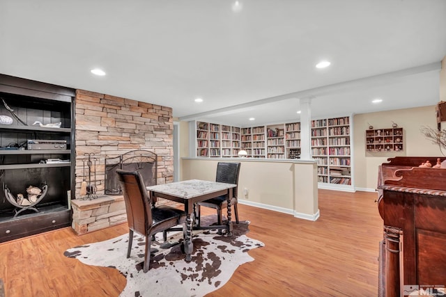 3295 Sunnyvale Ave, Reno, NV 89509 - dining space featuring built in features, a fireplace, wood finished floors, and recessed lighting