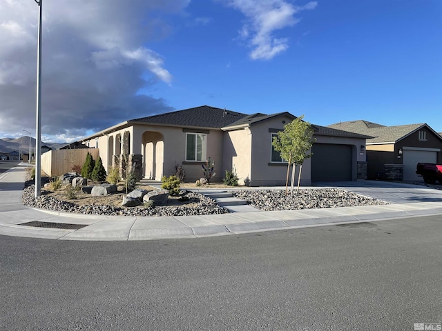 1848 Boundary Peak St, Carson City, NV 89701 - single story home featuring a garage, stucco siding, concrete driveway, and fence
