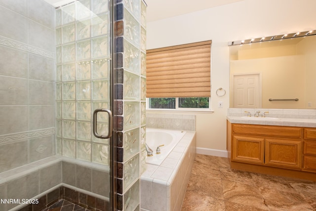 706 Norfolk Dr, Carson City, NV 89703 - full bathroom featuring a stall shower, a garden tub, and vanity