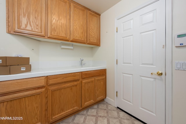 706 Norfolk Dr, Carson City, NV 89703 - kitchen with a sink and brown cabinetry