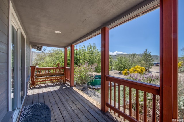 14865 N Red Rock Rd, Reno, NV 89508 - wooden deck with a mountain view and covered porch
