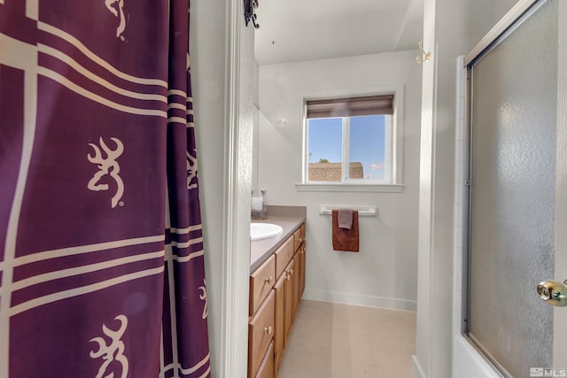 14865 N Red Rock Rd, Reno, NV 89508 - bathroom with a shower with door, vanity, and baseboards