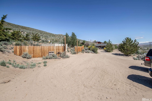 14865 N Red Rock Rd, Reno, NV 89508 - view of yard with fence and a mountain view