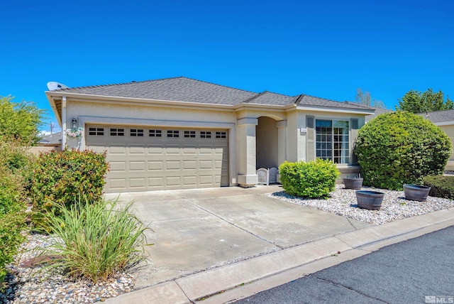 1230 Quail Run Dr, Carson City, NV 89701 - view of front of property featuring a garage, stucco siding, and concrete driveway