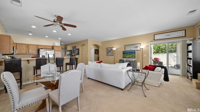 1230 Quail Run Dr, Carson City, NV 89701 - dining space with light carpet, a ceiling fan, arched walkways, and recessed lighting
