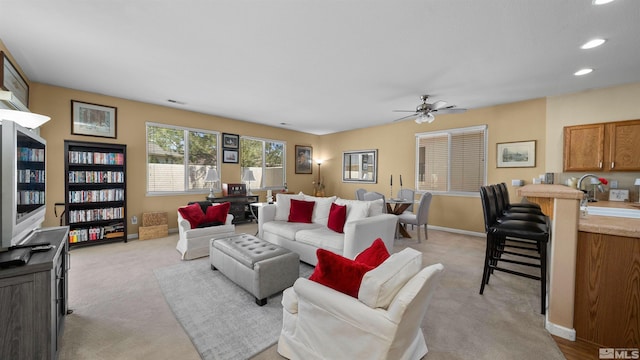1230 Quail Run Dr, Carson City, NV 89701 - living room featuring light colored carpet, ceiling fan, baseboards, and recessed lighting
