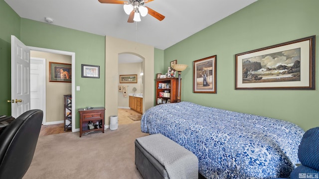 1230 Quail Run Dr, Carson City, NV 89701 - bedroom with carpet flooring, arched walkways, baseboards, a ceiling fan, and ensuite bath